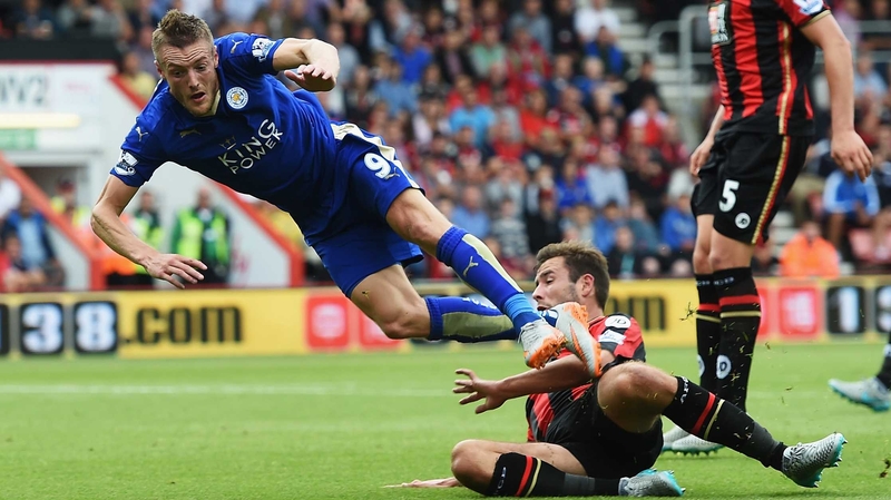Steve Cook of Bournemouth takes down Jamie Vardy of Leicester City