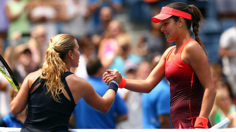 Dominika Cibulkova of Slovakia shakes hands with Ana Ivanovic afterwards