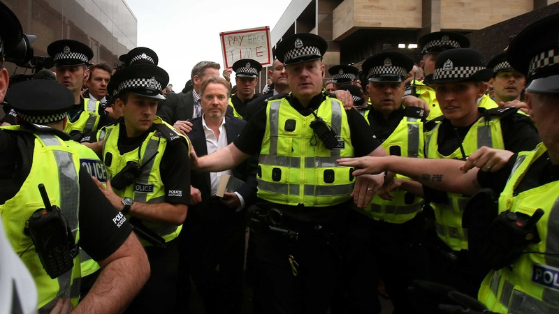 Craig Whyte leaves Glasgow Sheriff Court surrounded by police officers