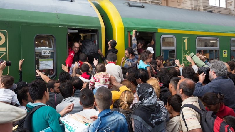 Hundreds of people crammed onto trains at Budapest station