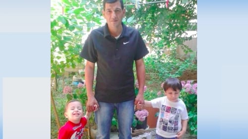 Aylan Al-Kurdi (L) and his brother Galip (R) with their father Abdullah (C)
