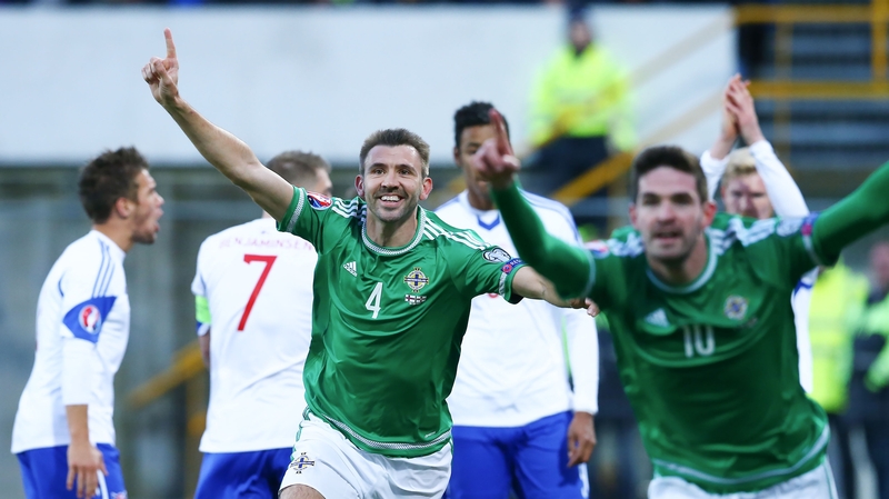 Gareth McAuley (l) scored on the double for Michael O'Neill's side