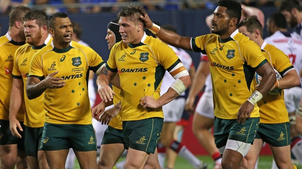 Australia's Sean McMahon is congratulated after scoring a try at Soldier Field