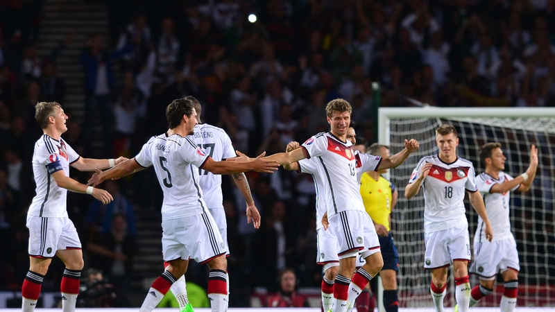 Thomas Muller celebrates with his team-mates after scoring Germany's second goal against Scotland