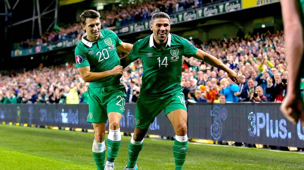 Jonathan Walters celebrates scoring against Georgia with Wes Hoolahan
