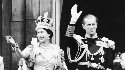 Elizabeth and Prince Philip wave after she is crowned Queen in 1953