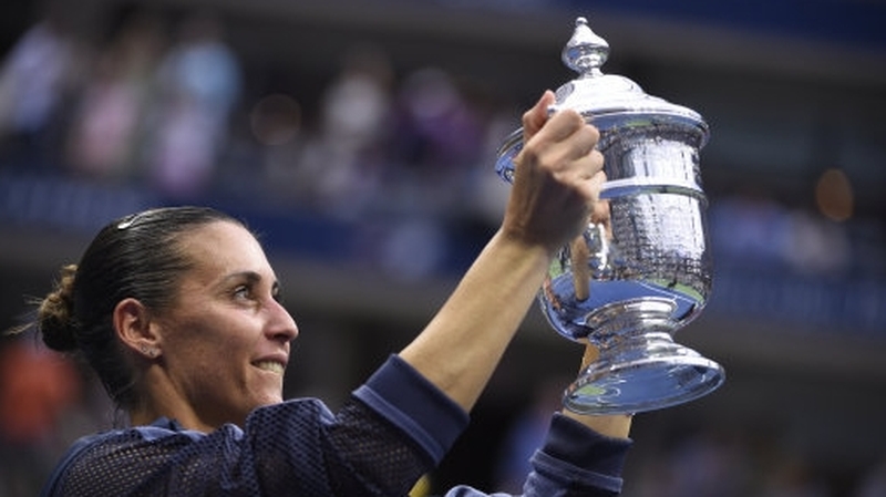 Flavia Pennetta lifts the US Open trophy at Flushing Meadows