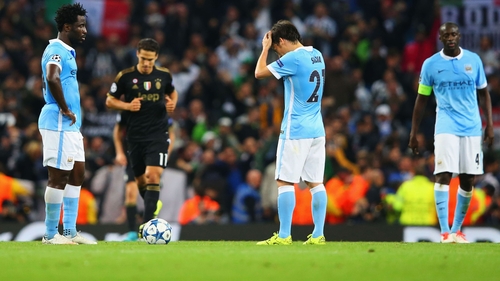 Wilfred Bony, David Silva and Yaya Toure of Manchester City look dejected after Alvaro Morata's winner