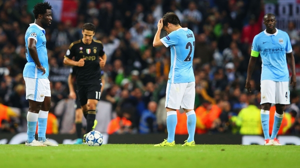 Wilfred Bony, David Silva and Yaya Toure of Manchester City look dejected after Alvaro Morata's winner
