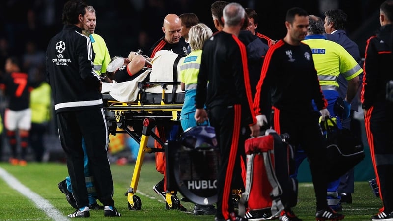 Louis van Gaal looks on as medics tend to Luke Shaw as he leaves the field in Eindhoven