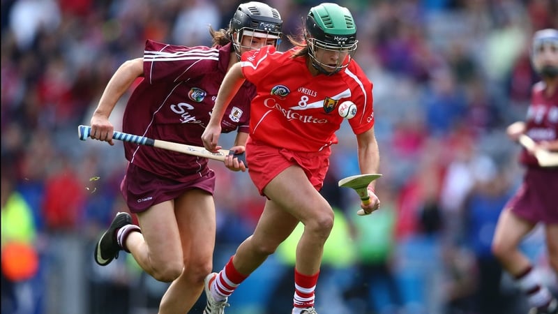 Julia White skips clear of Galway's Siobhan Coen at Croke Park