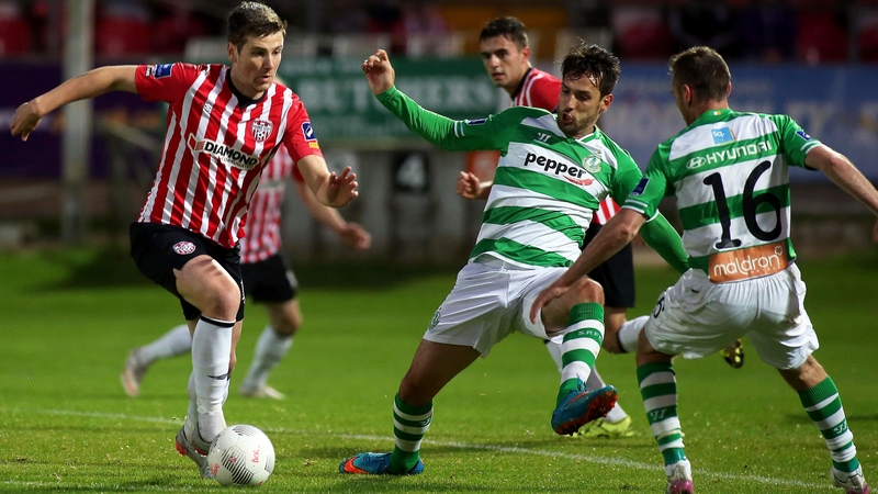 Patrick McEleney in possession against Maxime Blanchard and Patrick Cregg