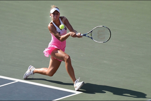 Magda Linette hits a return