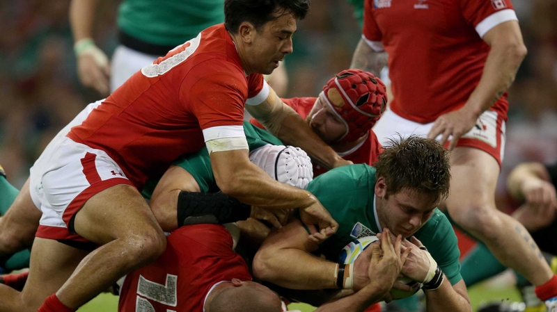 Iain Henderson squeezes over for his try against Canada