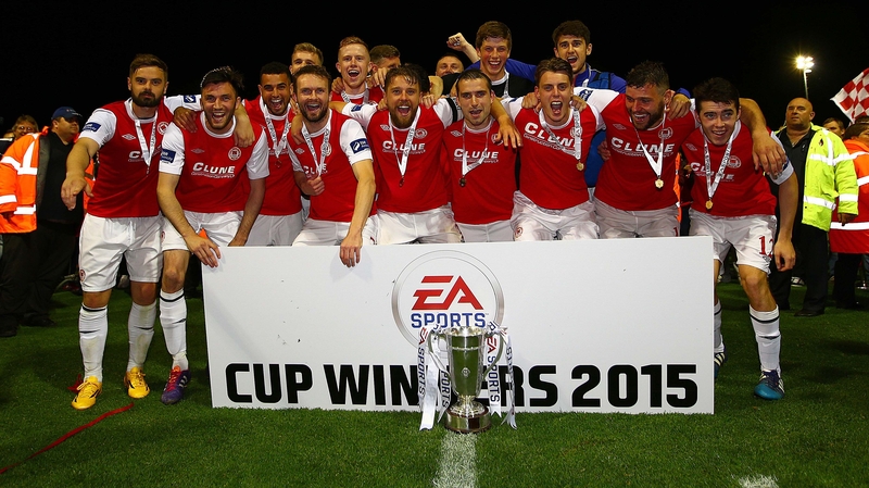 St Pat's players celebrate with the trophy