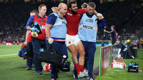 France winger Yoann Huget is helped off the field