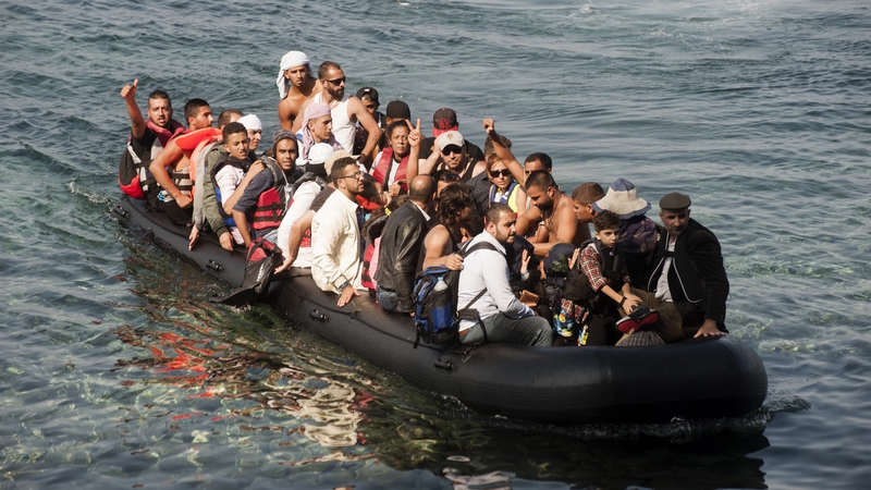 People arrive on the shore of Sykamias beach, Lesbos, Greece