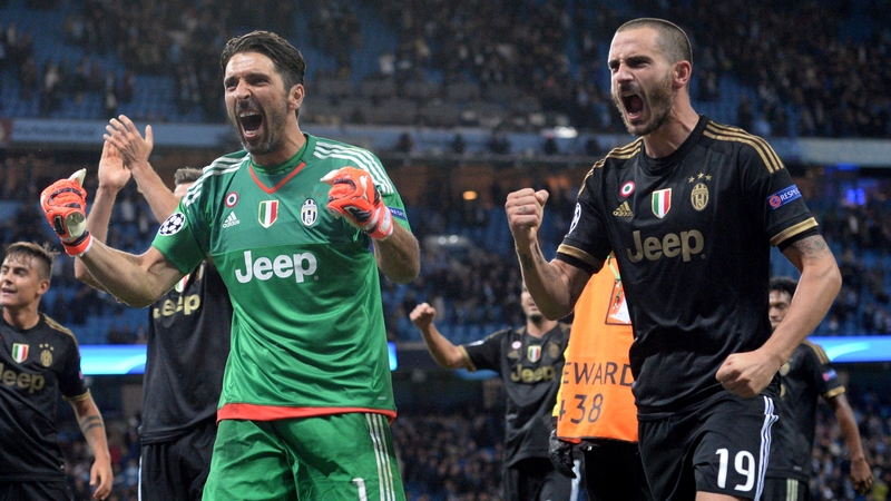 Juventus players celebrate after defeating Man City in their opening group game in the Champions League