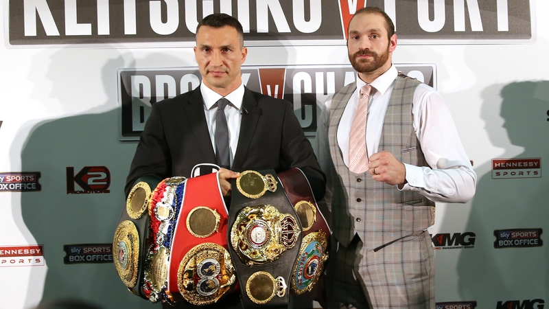 Tyson Fury (L) had been due to challenge for Wladimir Klitschko's three world heavyweight titles