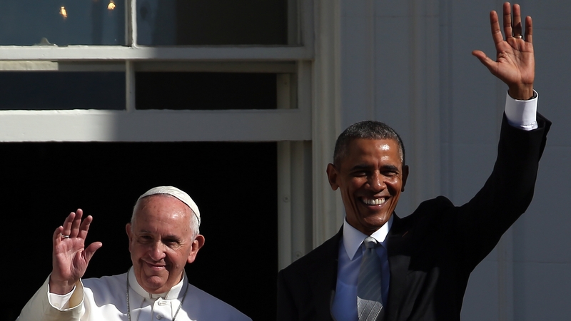 Pope Francis and President Barack Obama wave from the White House balcony