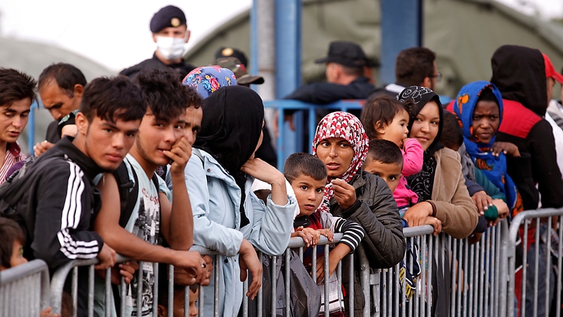 Refugees wait at a refugee camp near the Serbia-Croatia border