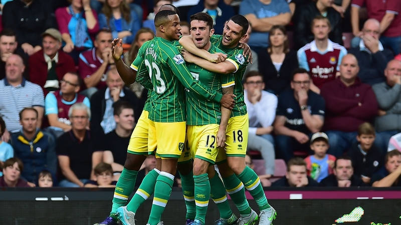 Robbie Brady is mobbed by team mates after scoring for Norwich against West Ham