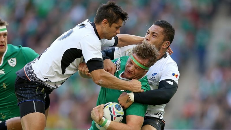 Jamie Heaslip takes a big hit against Romania and RWC 2015