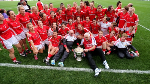 Cork celebrate after winning the match