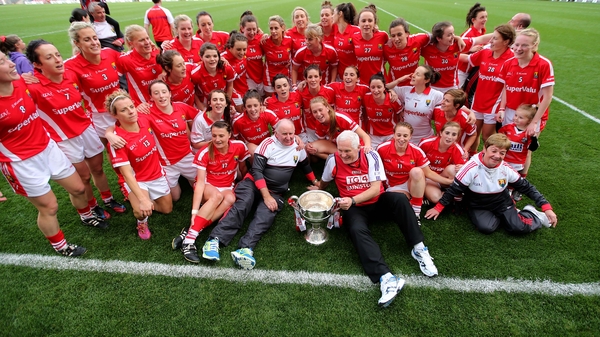 Cork celebrate after winning the match