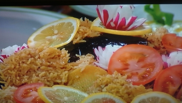 Makloubeh served with Cucumber Salad