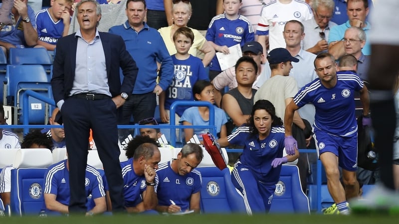 Eva Carneiro and head physio Jon Fearn (R) leave the bench to treat Eden Hazard
