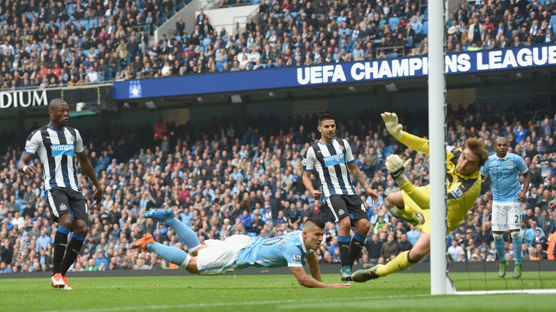 Sergio Aguero scores the opening goal for Manchester City