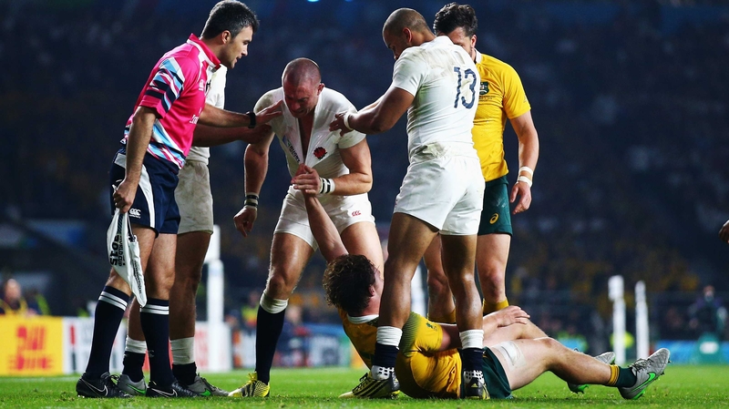 Mike Brown (c) reacts to a dangerous challenge from Australia flanker Michael Hooper