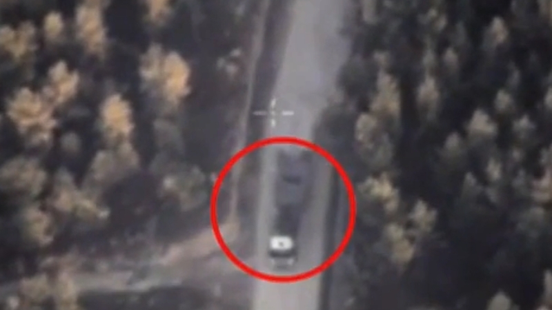 Footage released by the Russian Defence Ministry showing a drone taking aim at what it says is an IS truck