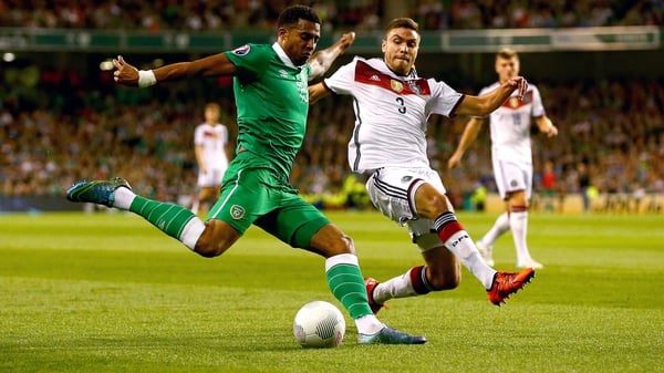 Ireland's Cyrus Christie holds off Jonas Hector of Germany