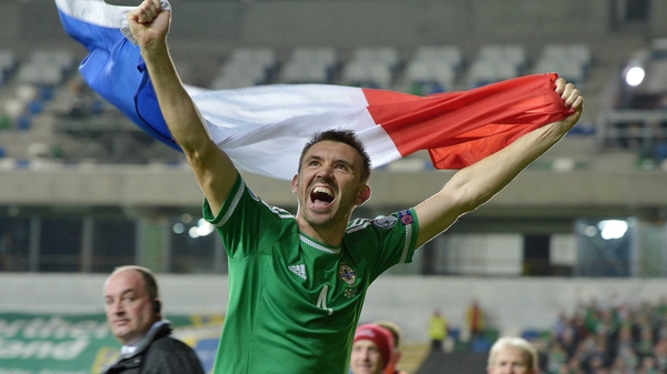 Gareth McAuley celebrates his country's qualification for EURO 2016