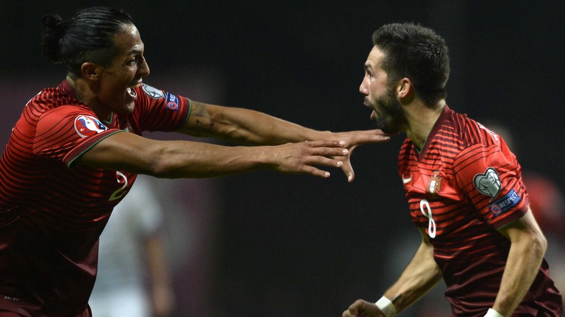 Portugal's Joao Moutinho (R) celebrates with Bruno Alves