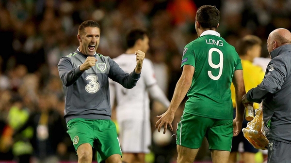 Robbie Keane congratulates Shane Long at the end