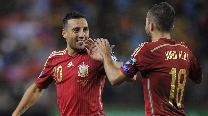 Santi Cazorla celebrates his goal with Jordi Alba