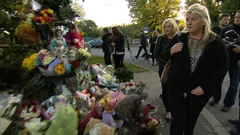People mourning after the death of 10 people in the Carrickmines fire in 2015. Photo: RTÉ