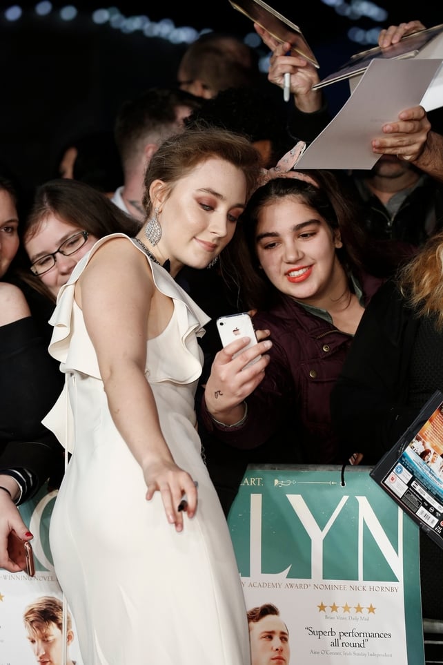 The Brooklyn star poses for photos