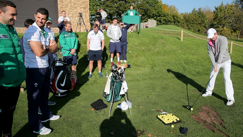Rory McIlroy tees off as the Irish players watch on at Celtic Manor, Wales
