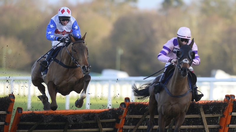 Zarkandar (r) jumping the last in the 2014 Long Walk Hurdle at Ascot