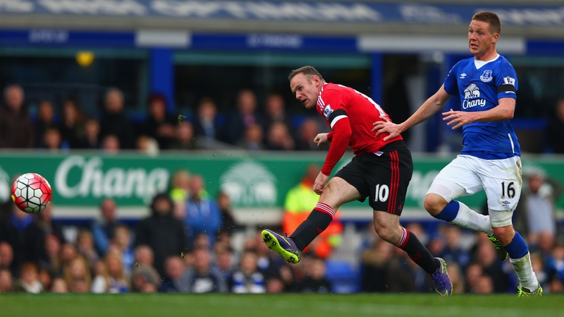 Wayne Rooney scores his team's third goal