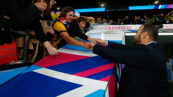 Michael Cheika celebrates with fans after Australia reached the Rugby World Cup semi-finals
