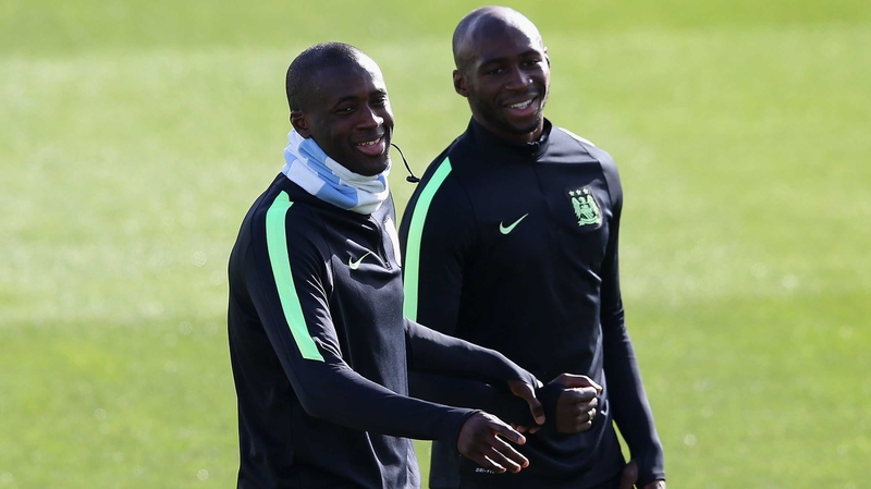 Yaya Toure and Eliaquim Mangala share a joke at training