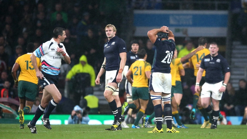 Craig Joubert hastily exits the pitch after Australia's one-point victory over Scotland on Sunday