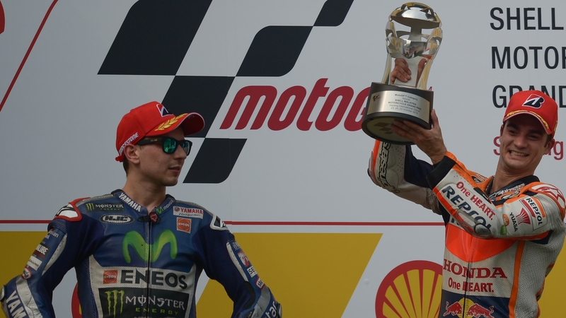 Dani Pedrosa celebrates on the podium after his victory