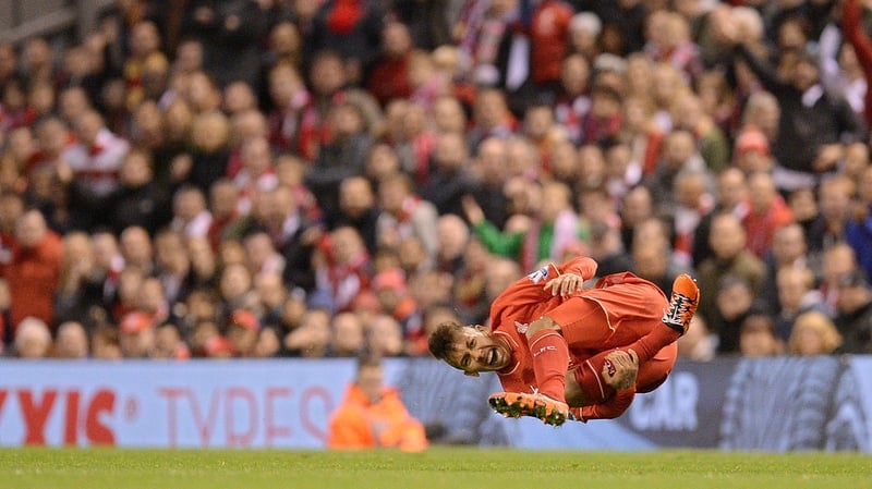 Liverpool's Brazilian midfielder Roberto Firmino reacts after being injured during the 1-1 draw with Southampton