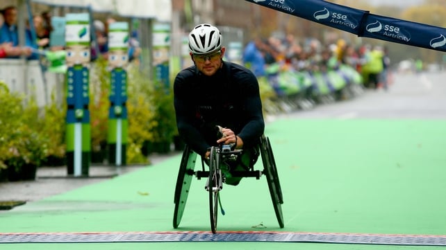 Wheelchair winner Patrick Monahan crosses the line